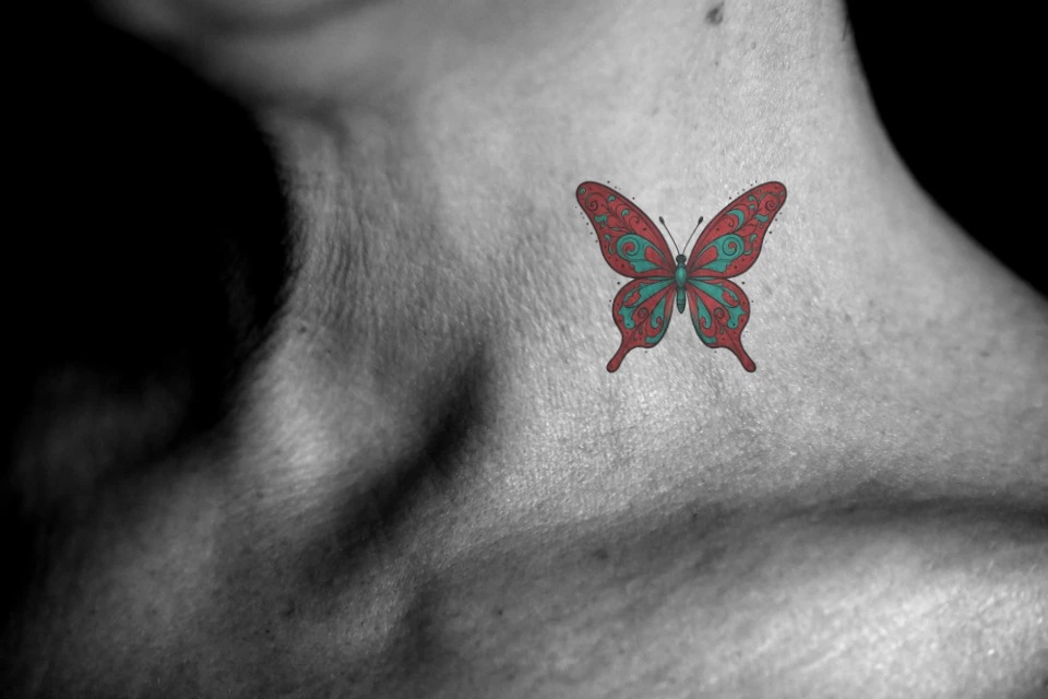 The same red and turquoise butterfly previewed on the side of a neck